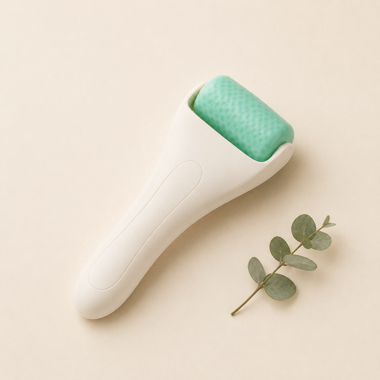 Cooling Ice Roller studio shot with eucalyptus, cream and teal