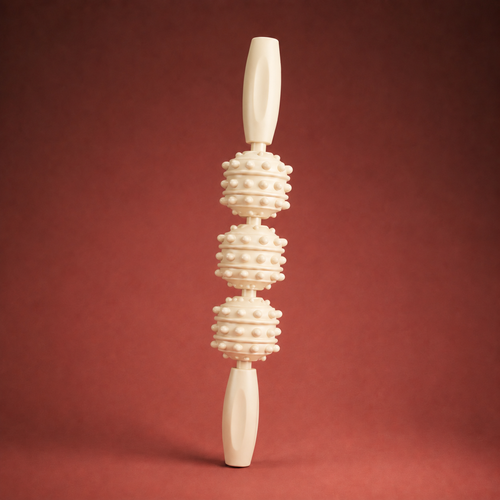 Cream muscle roller stick standing vertical on warm crimson studio backdrop